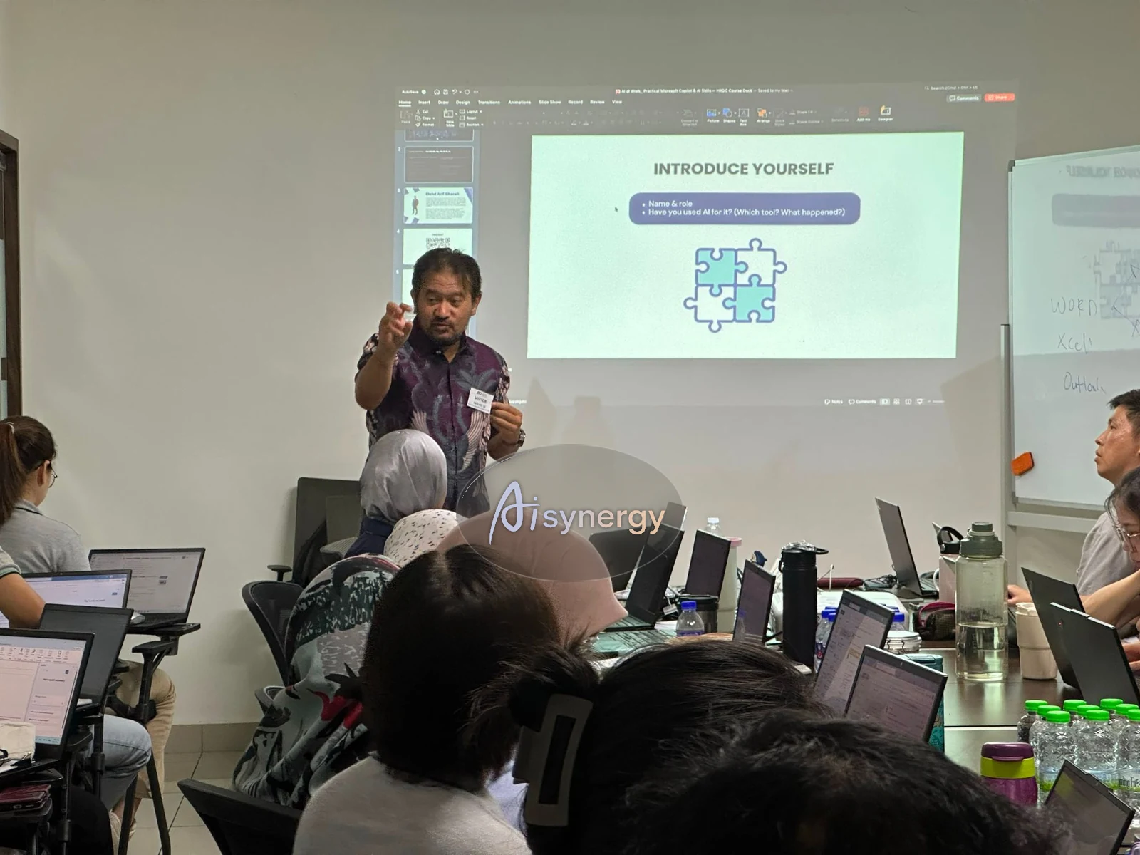 AISynergy trainer engaging the room during an interactive session